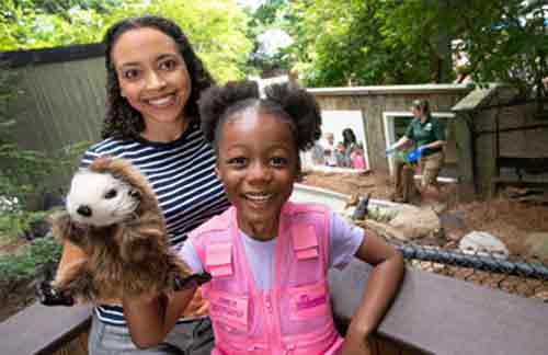 Girl with otter puppet